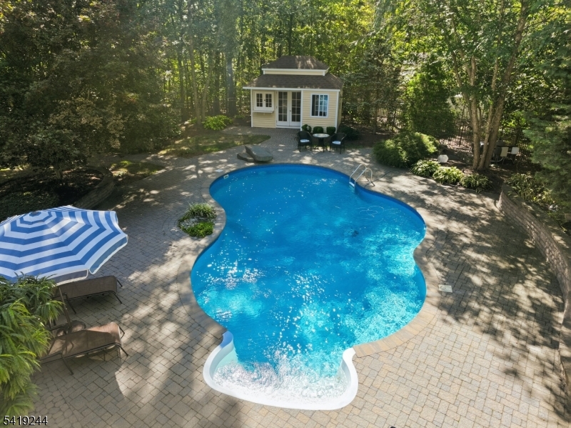 57 Paderewski Road Oak Ridge, NJ 07438 - Photo 40 of 42 a view of a porch with furniture and a yard