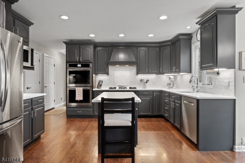 57 Paderewski Road Oak Ridge, NJ 07438 - Photo 5 of 42 a kitchen with a sink stainless steel appliances and counter space