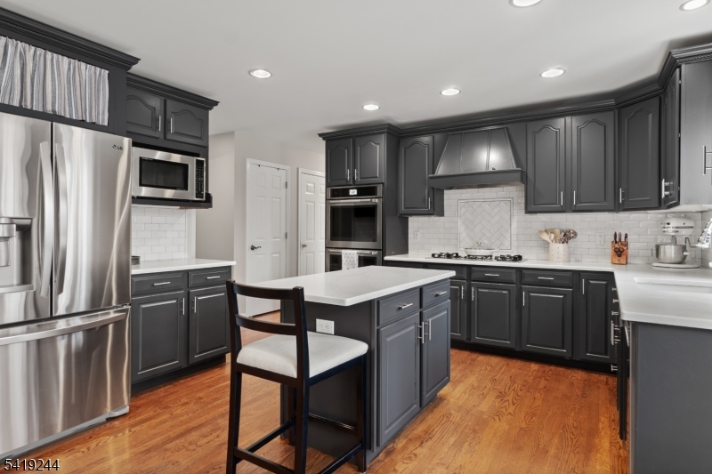 57 Paderewski Road Oak Ridge, NJ 07438 - Photo 6 of 42 a kitchen with granite countertop a sink stainless steel appliances and cabinets