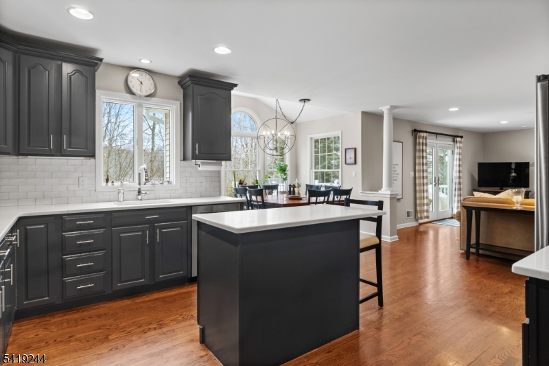57 Paderewski Road Oak Ridge, NJ 07438 - Photo 9 of 42 a large kitchen with a large counter top sink stainless steel appliances and cabinets