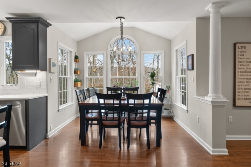 57 Paderewski Road Oak Ridge, NJ 07438 - Photo 10 of 42 a view of a dining room with furniture window and wooden floor