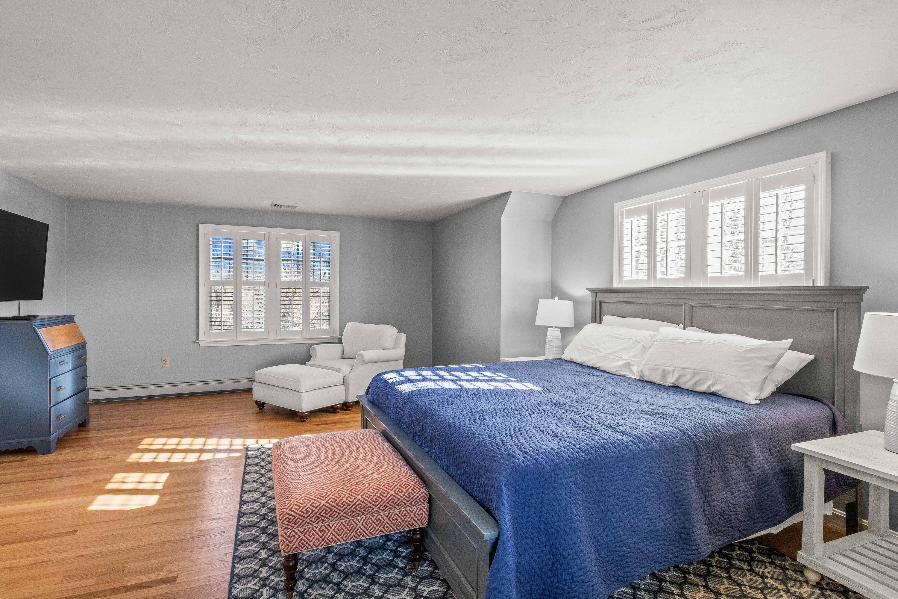 356 Lower County Road Harwich Port, MA 02646 - Photo 19 of 27 a bedroom with a bed and wooden floor