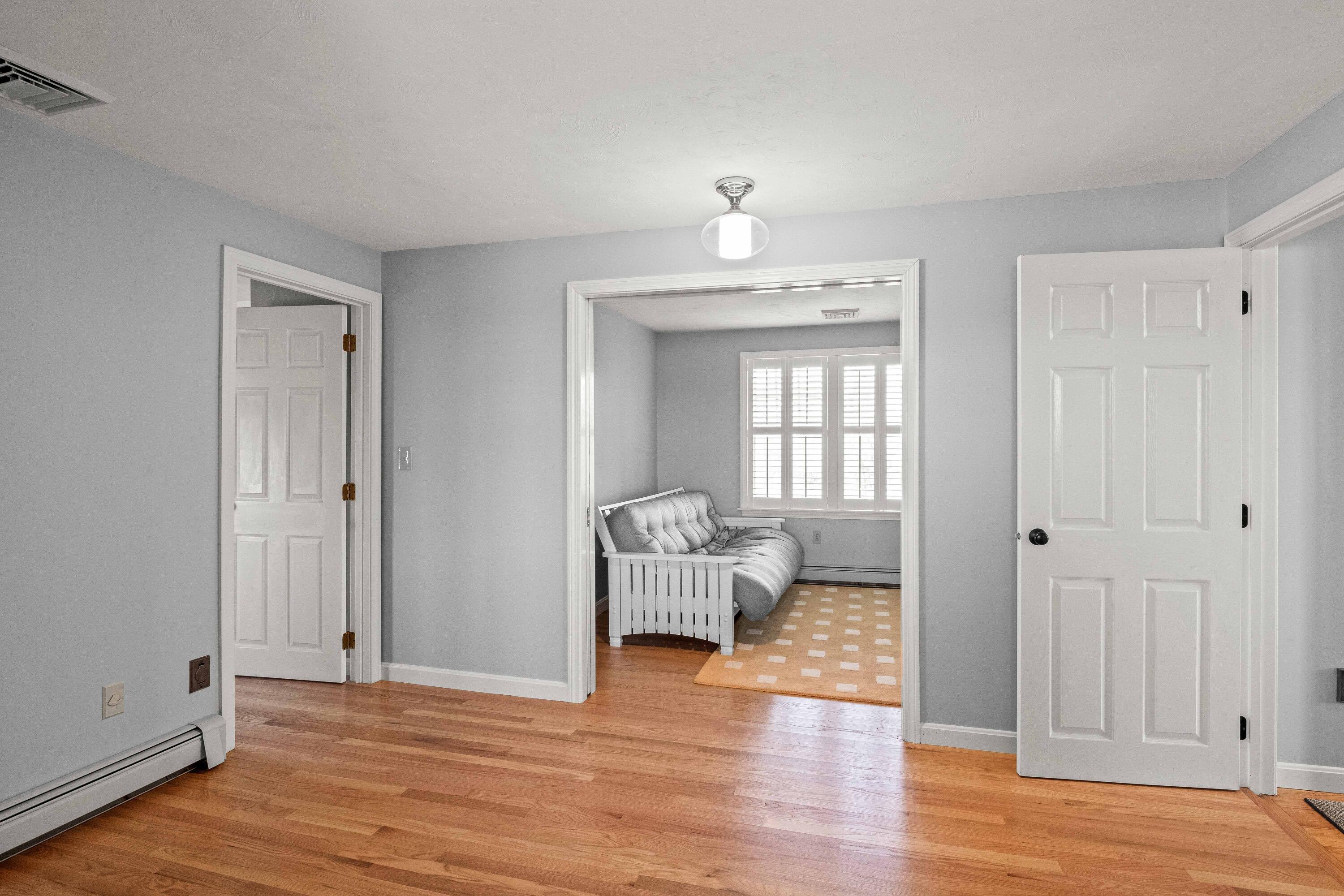 356 Lower County Road Harwich Port, MA 02646 - Photo 22 of 27 a view of livingroom with hardwood floor and hallway