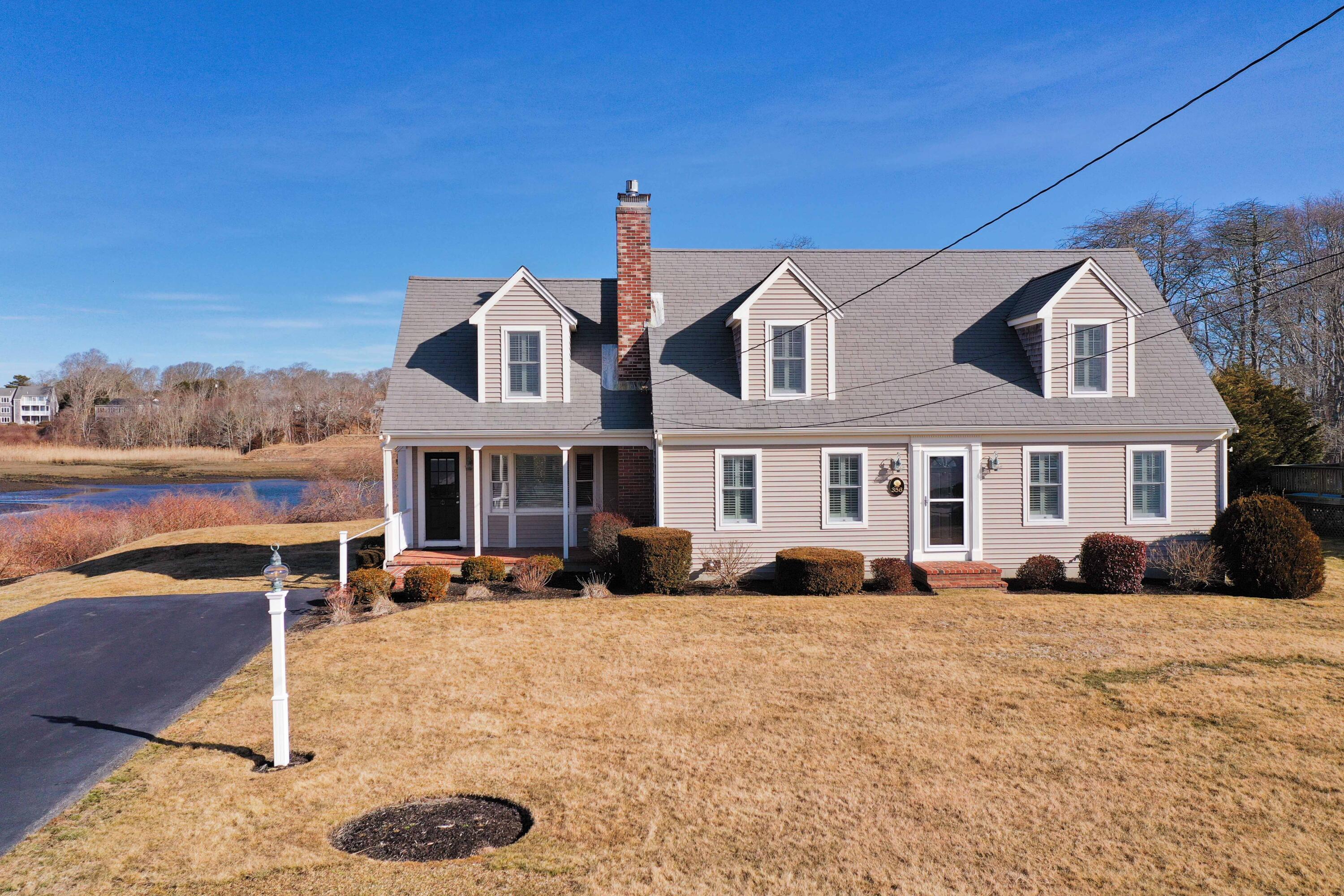 356 Lower County Road Harwich Port, MA 02646 - Photo 4 of 27 a front view of a house with a yard