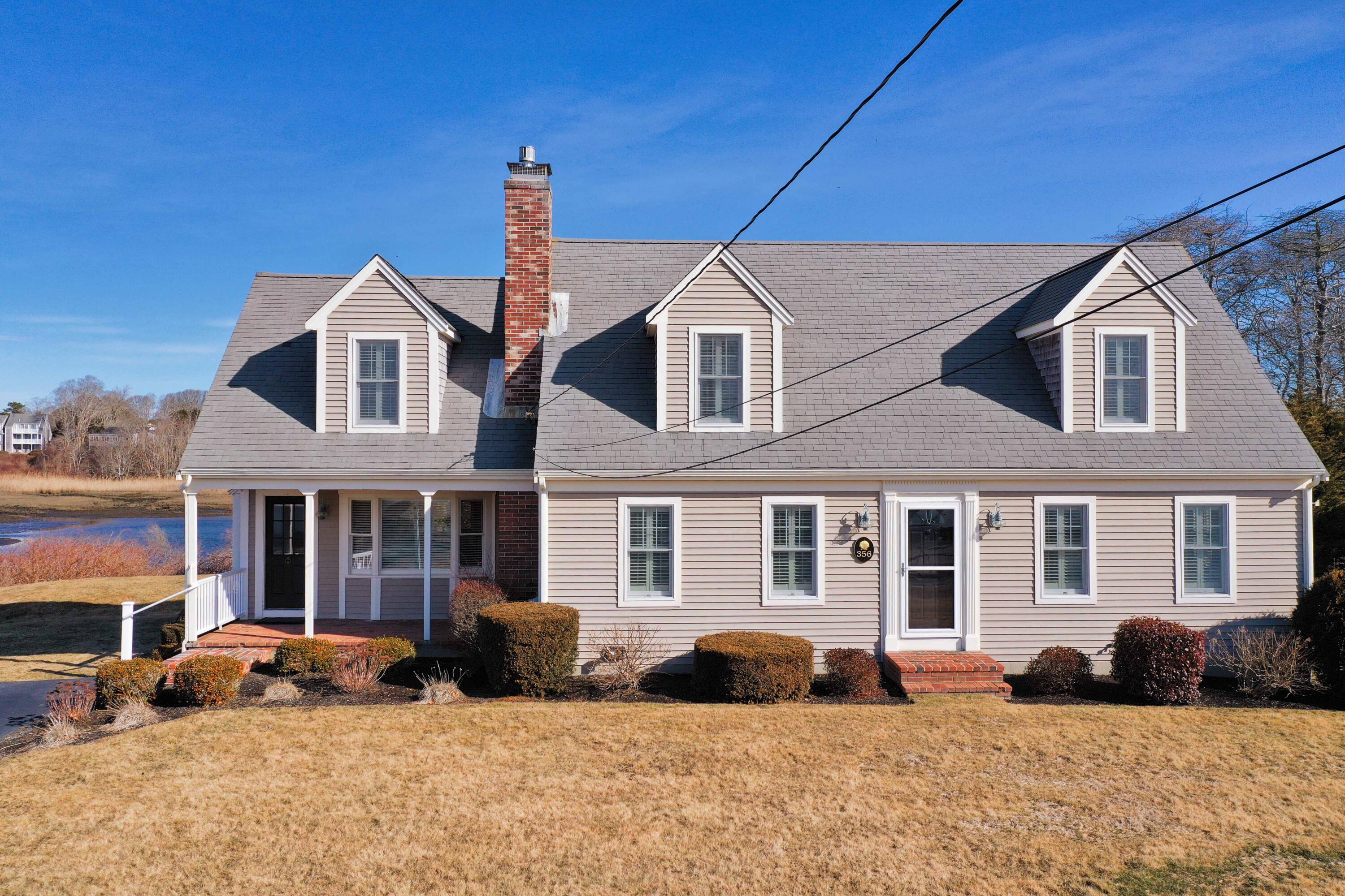 356 Lower County Road Harwich Port, MA 02646 - Photo 5 of 27 a front view of a house with a yard