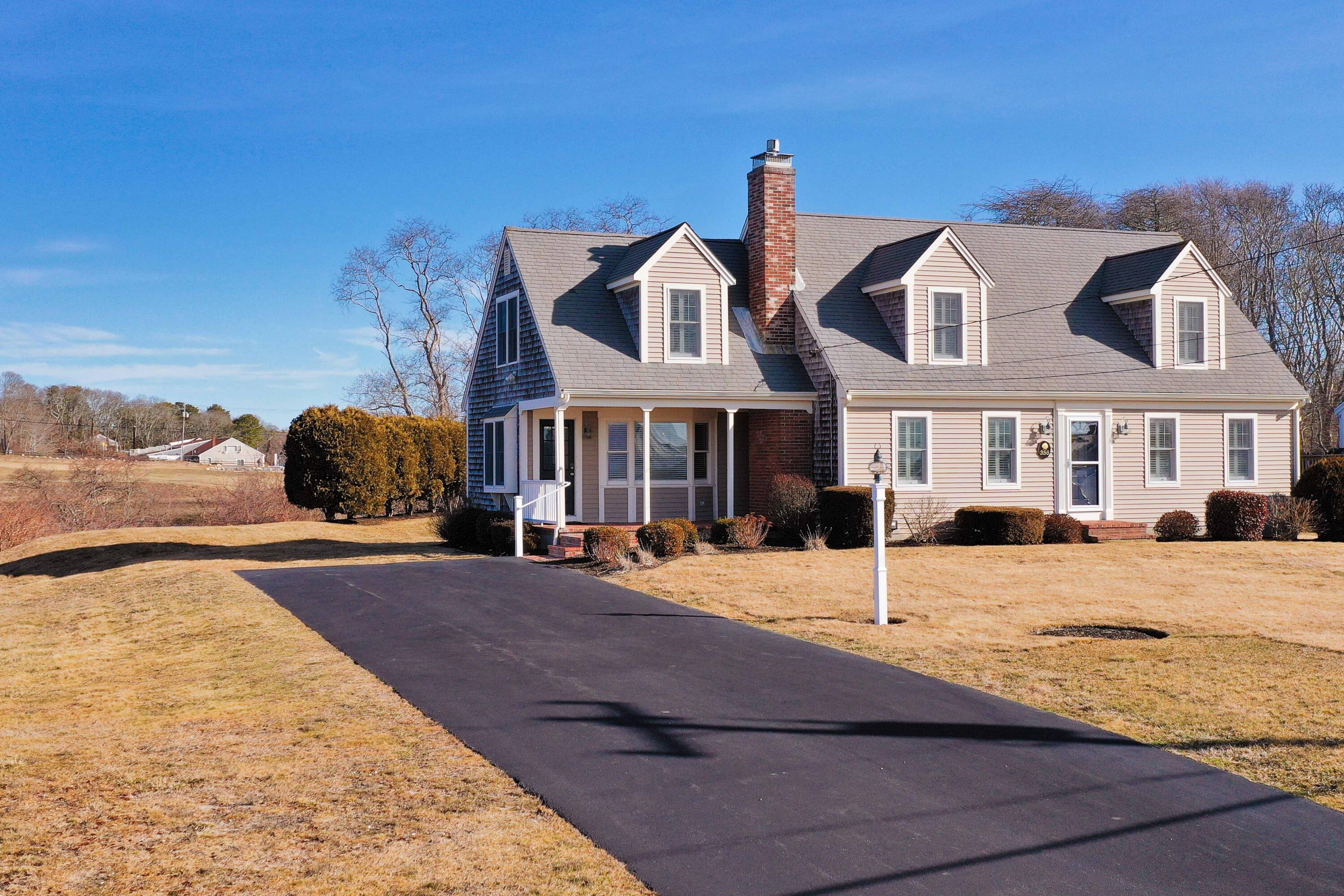 356 Lower County Road Harwich Port, MA 02646 - Photo 6 of 27 a front view of a house with a yard