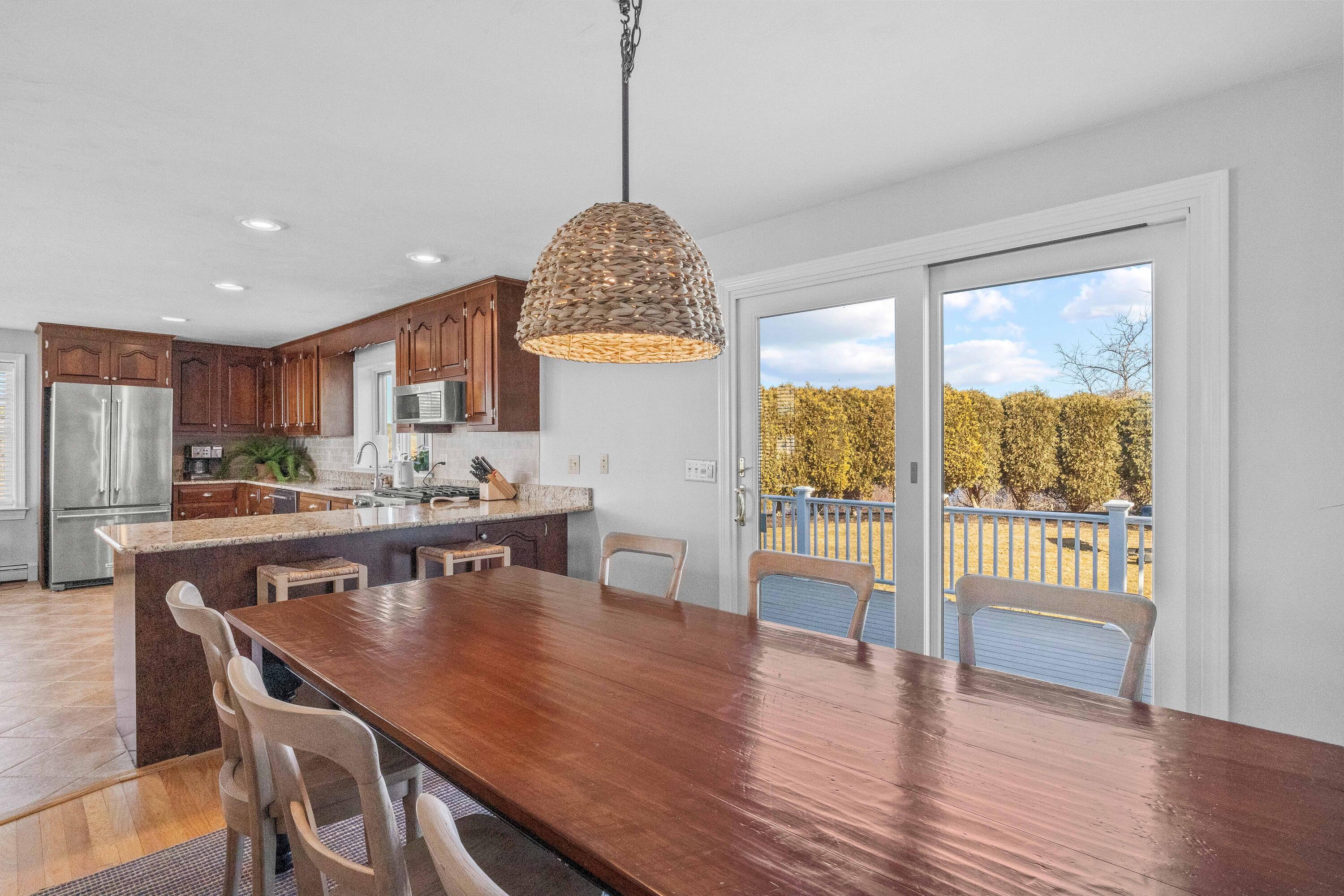 356 Lower County Road Harwich Port, MA 02646 - Photo 10 of 27 a view of a dining room with furniture window and wooden floor