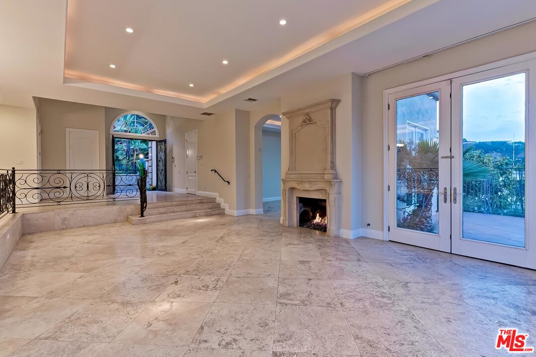 2121 Mt Olympus Drive Los Angeles, CA 90046 - Photo 12 of 34 a view of a livingroom with a fireplace and window
