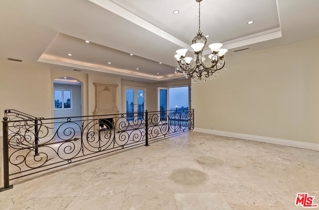 2121 Mt Olympus Drive Los Angeles, CA 90046 - Photo 14 of 34 a view of a room with furniture and chandelier