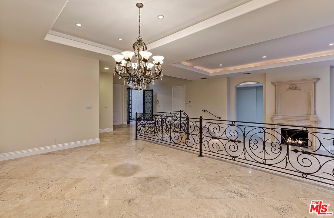 2121 Mt Olympus Drive Los Angeles, CA 90046 - Photo 15 of 34 a view of a room with lots of wooden furniture