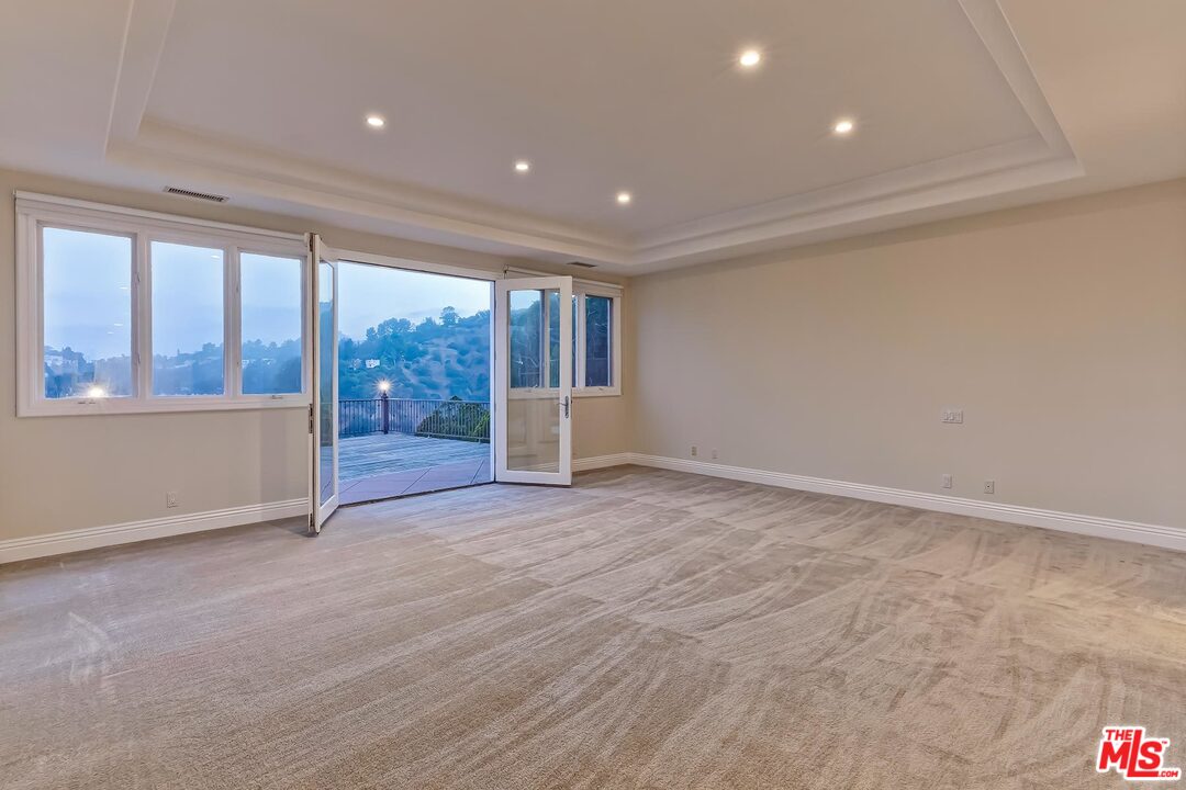 2121 Mt Olympus Drive Los Angeles, CA 90046 - Photo 23 of 34 a view of an empty room with a window