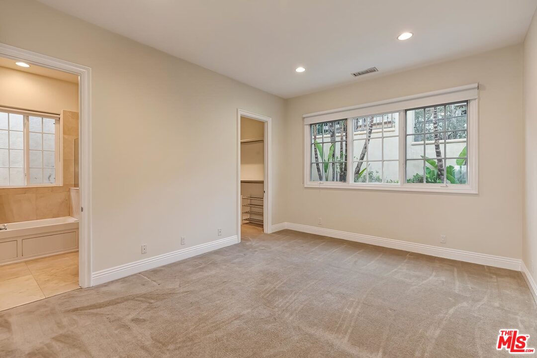 2121 Mt Olympus Drive Los Angeles, CA 90046 - Photo 28 of 34 an empty room with windows and closet