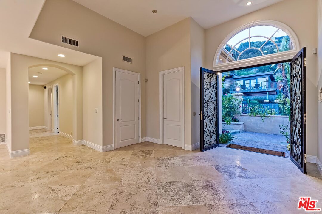 2121 Mt Olympus Drive Los Angeles, CA 90046 - Photo 7 of 34 a view of an entryway with a hallway