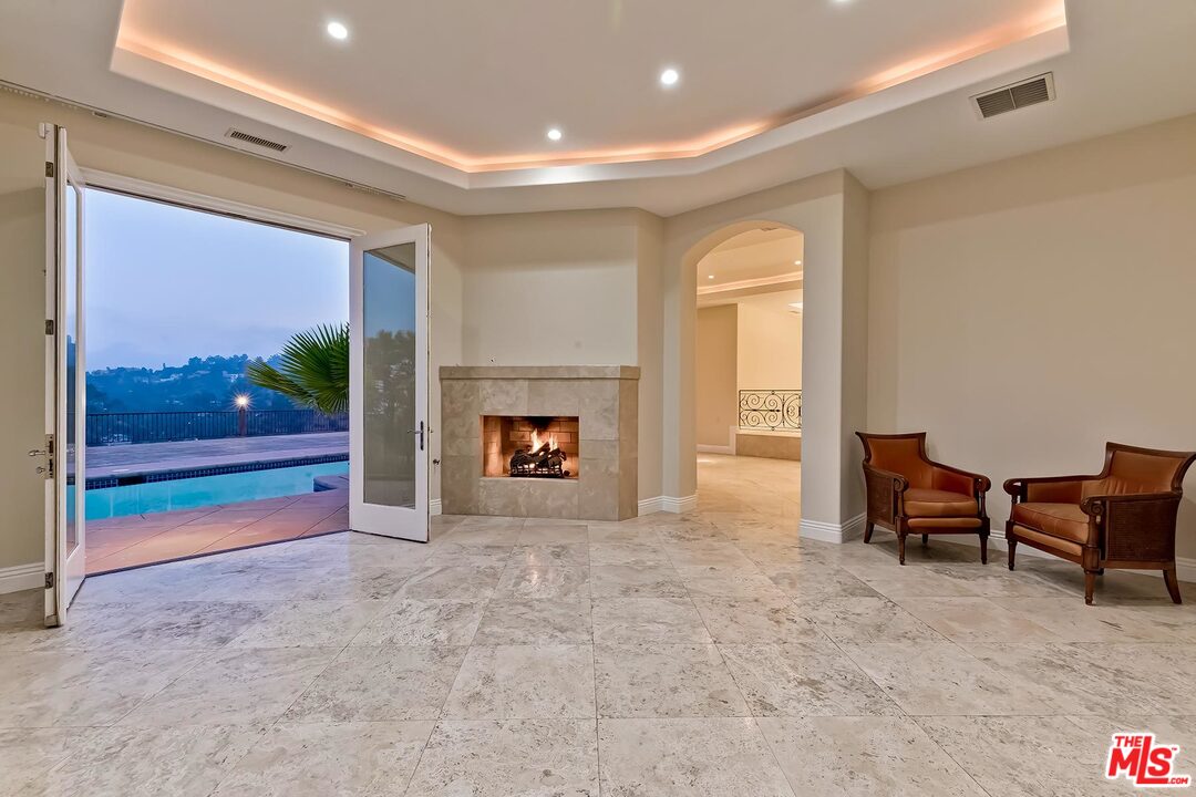 2121 Mt Olympus Drive Los Angeles, CA 90046 - Photo 9 of 34 a view of livingroom with furniture and a fireplace