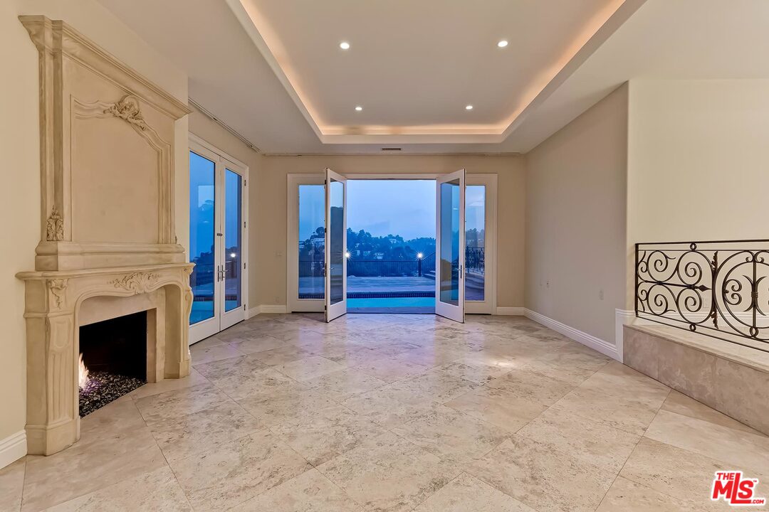 2121 Mt Olympus Drive Los Angeles, CA 90046 - Photo 10 of 34 a view of an empty room with a fireplace
