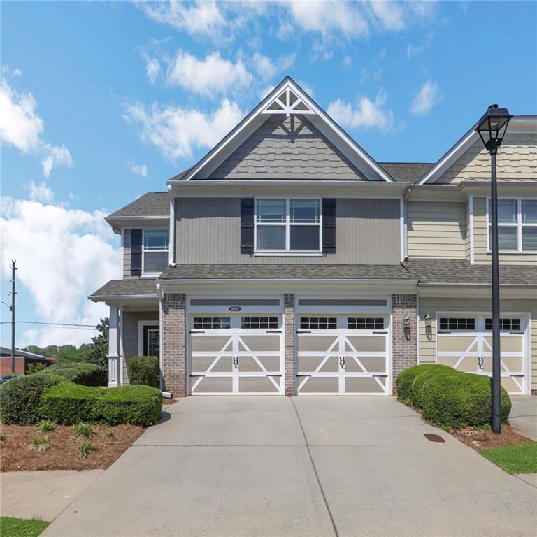 3552 Clear Creek Crossing Northwest Kennesaw, GA 30144 - Photo 1 of 41 a front view of a house with a yard and garage