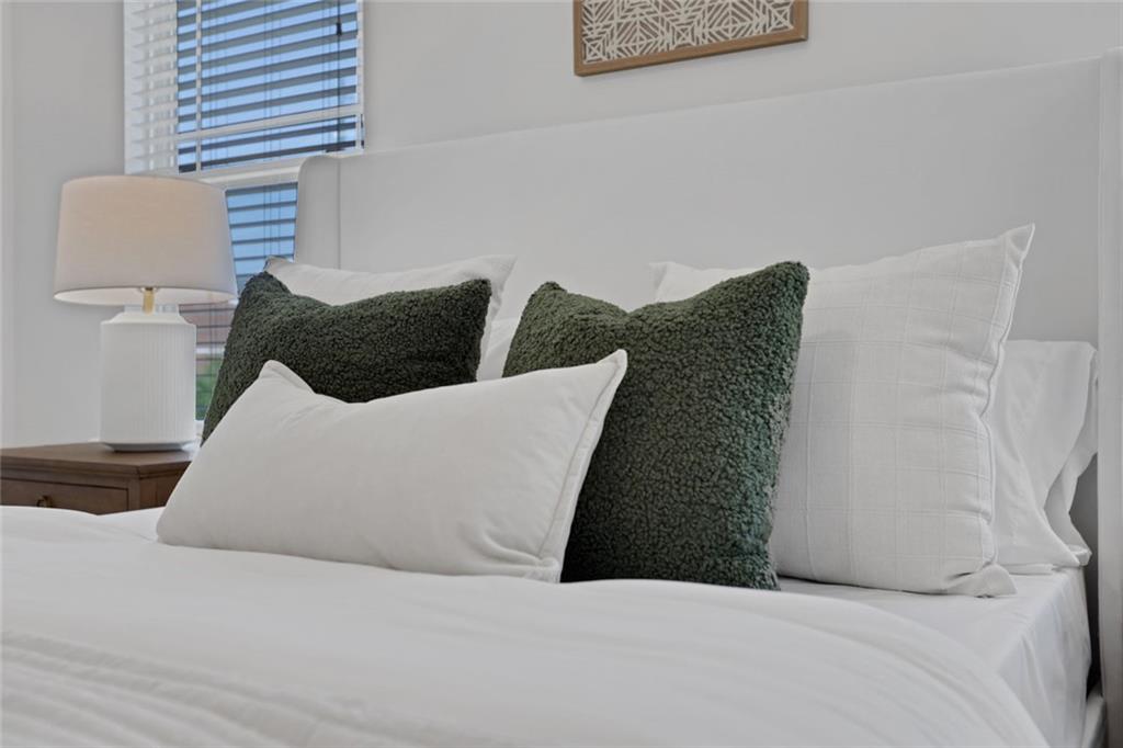 3552 Clear Creek Crossing Northwest Kennesaw, GA 30144 - Photo 27 of 41 a large bed sitting in a bedroom and chair