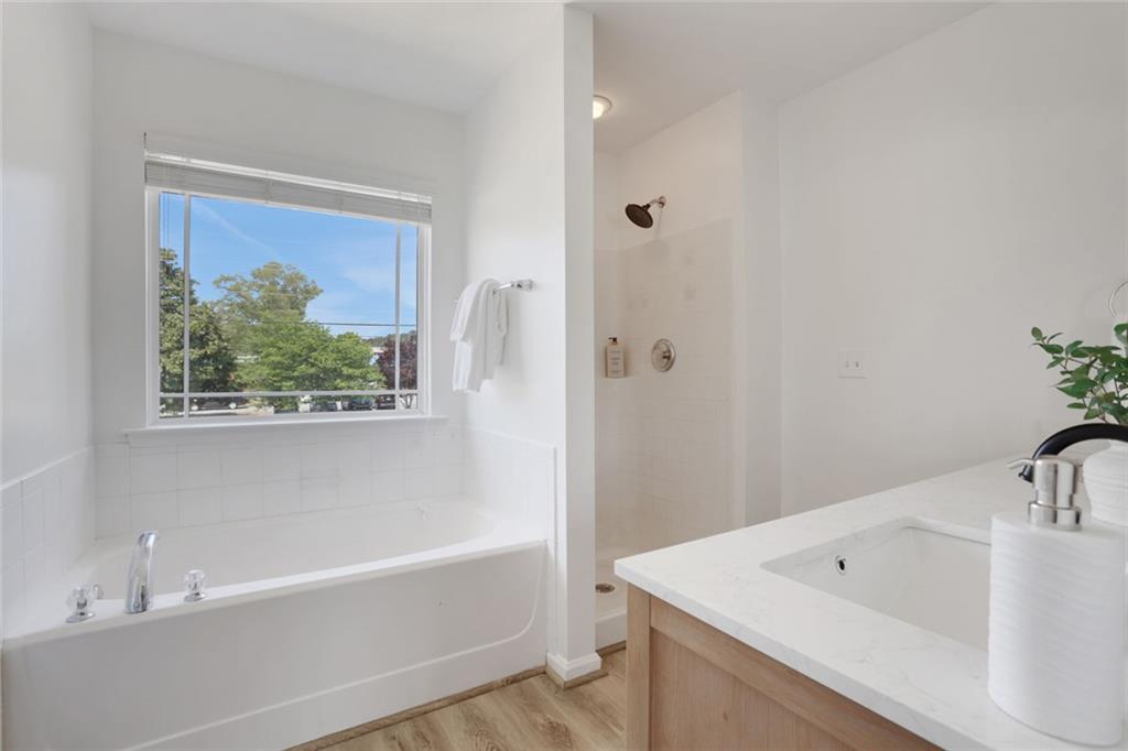 3552 Clear Creek Crossing Northwest Kennesaw, GA 30144 - Photo 30 of 41 a bathroom with a bathtub and a sink