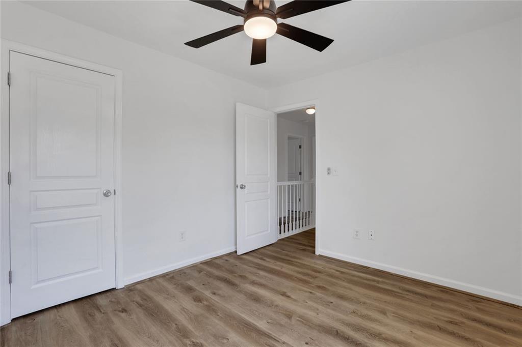3552 Clear Creek Crossing Northwest Kennesaw, GA 30144 - Photo 37 of 41 wooden floor in an empty room