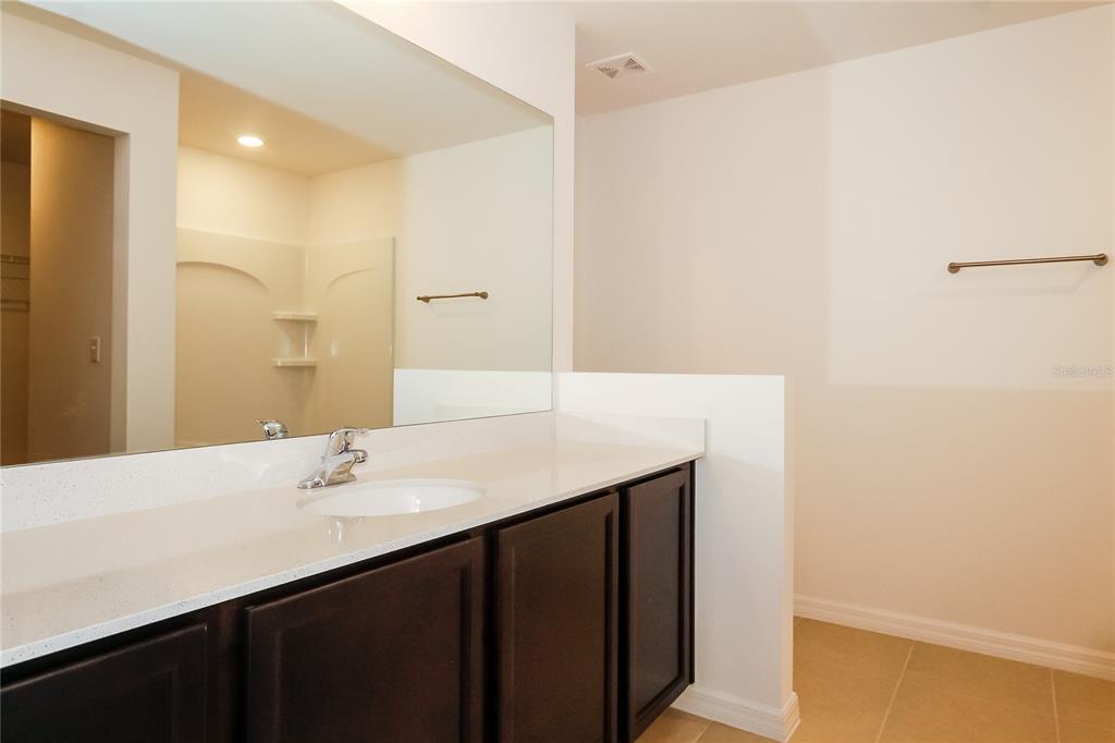 8615 Silverbell Loop Brooksville, FL 34613 - Photo 11 of 16 a bathroom with a sink and a mirror