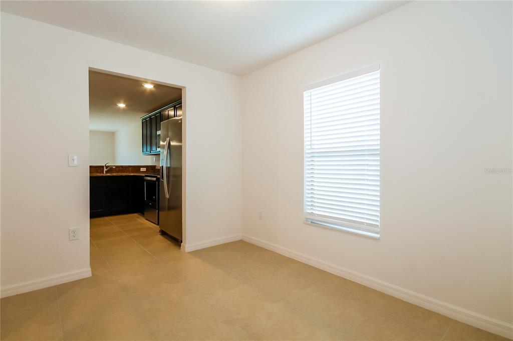 8615 Silverbell Loop Brooksville, FL 34613 - Photo 5 of 16 a view of kitchen and hallway with a window