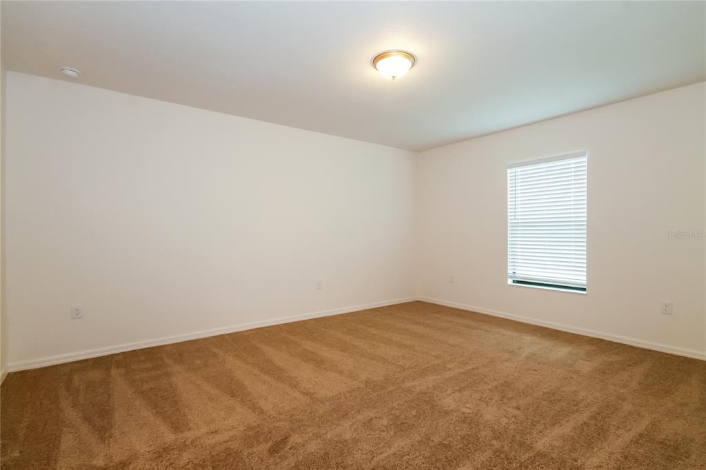 8615 Silverbell Loop Brooksville, FL 34613 - Photo 10 of 16 an empty room with a window