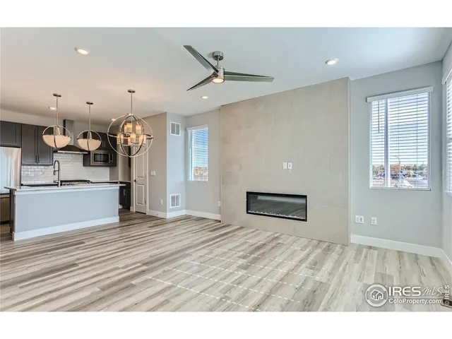 a view of a kitchen with a sink and a window
