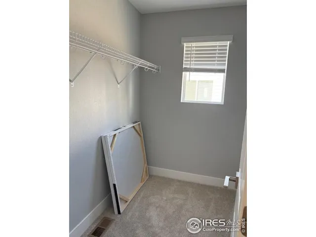 a bathroom with a sink double vanity and a mirror