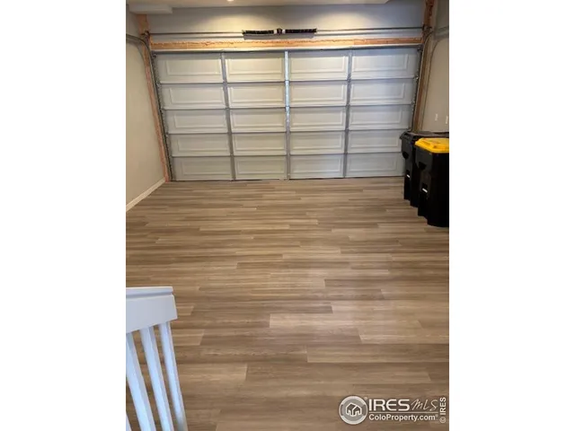 a room with a bed and mirror