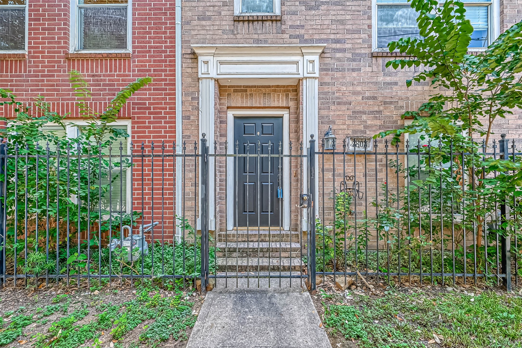 2804 Chenevert Street Houston, TX 77004 - Photo 2 of 37 a front view of a house with a garden
