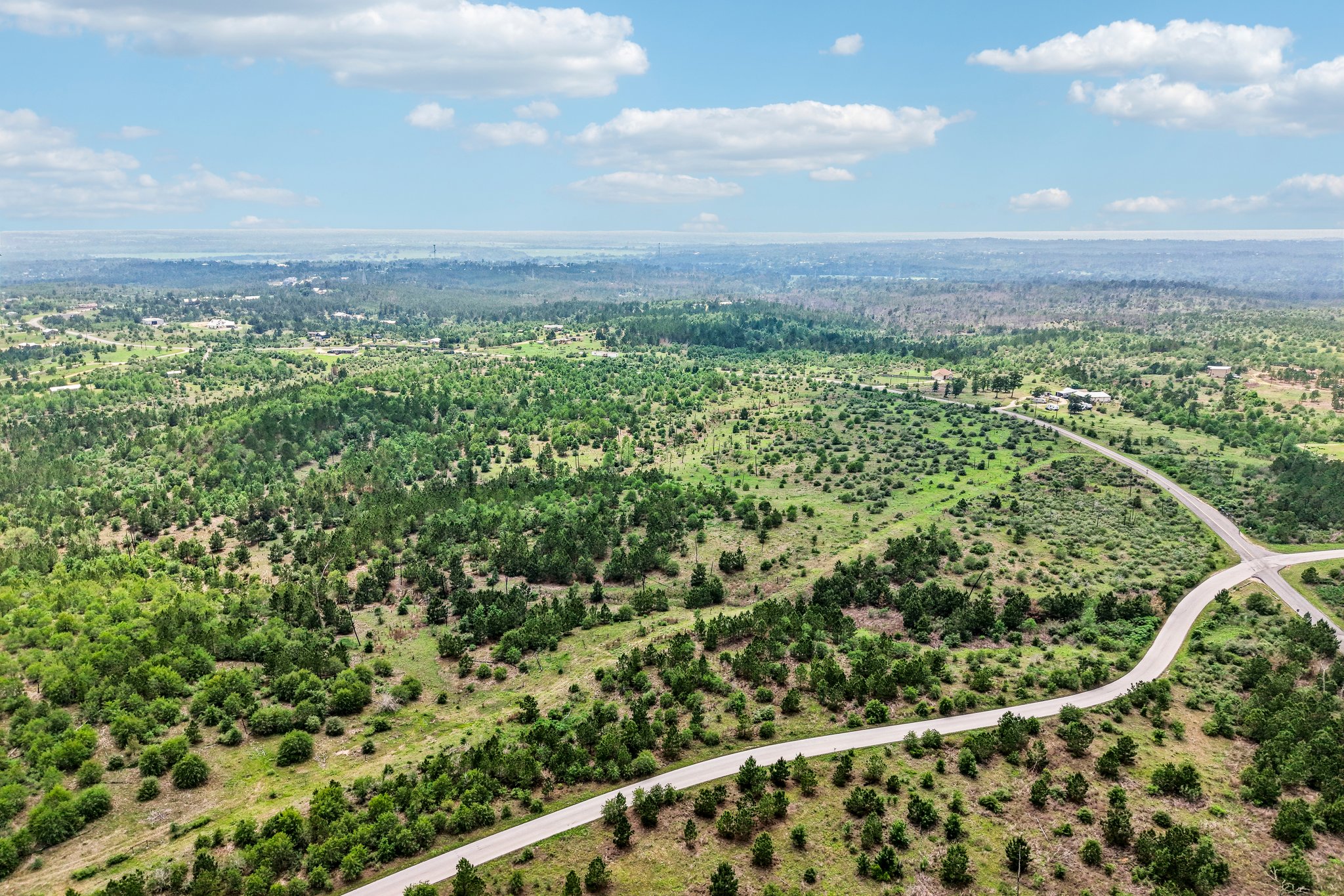 Expansive natural landscape featuring rolling hills and abundant greenery