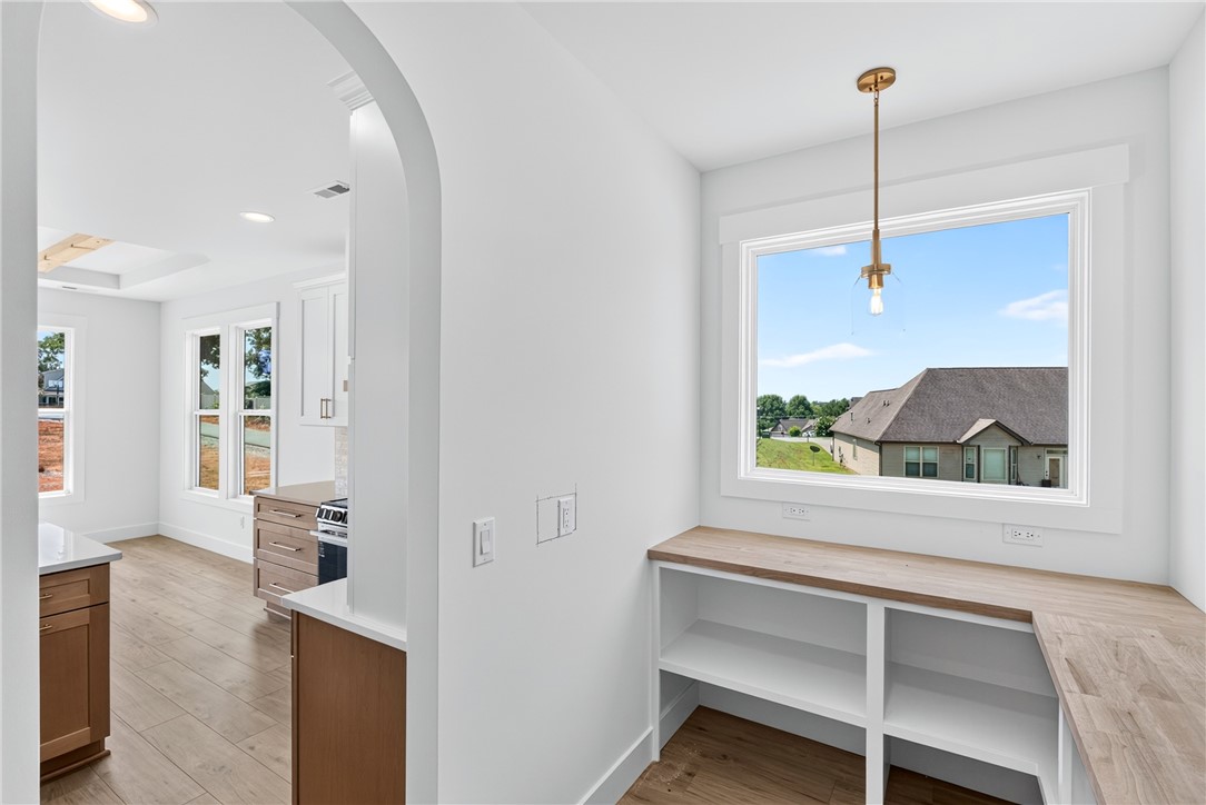 416 Blume Road Anderson, SC 29625 - Photo 12 of 29 A well-lit corner features built-in shelving, complemented by a large window overlooking the neighborhood.