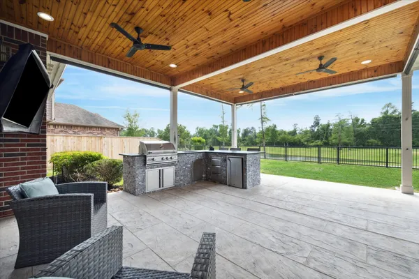 a view of a patio with a table and chairs