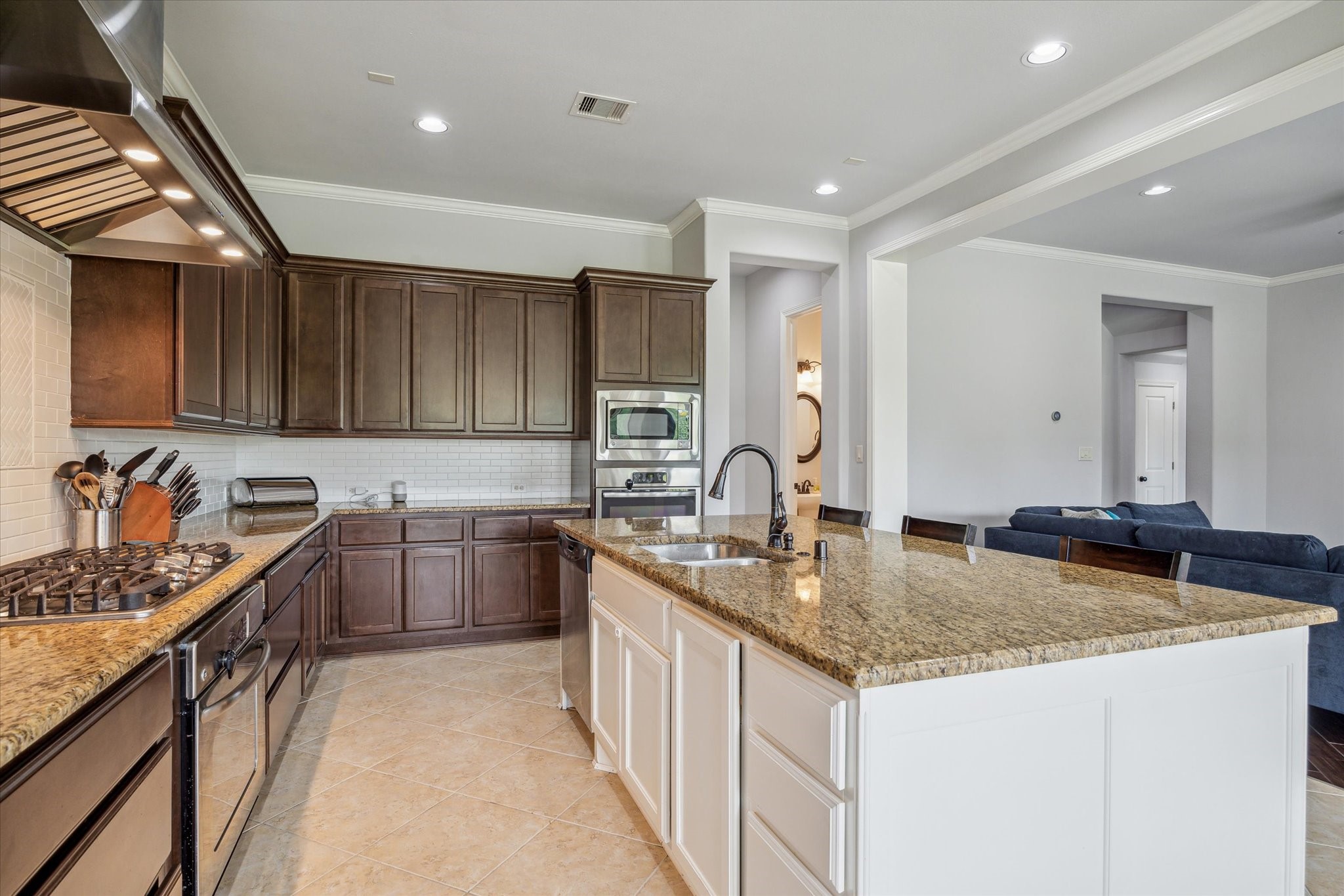 18531 Duke Lake Drive Spring, TX 77388 - Photo 13 of 41 a kitchen with stainless steel appliances granite countertop a sink stove and cabinets