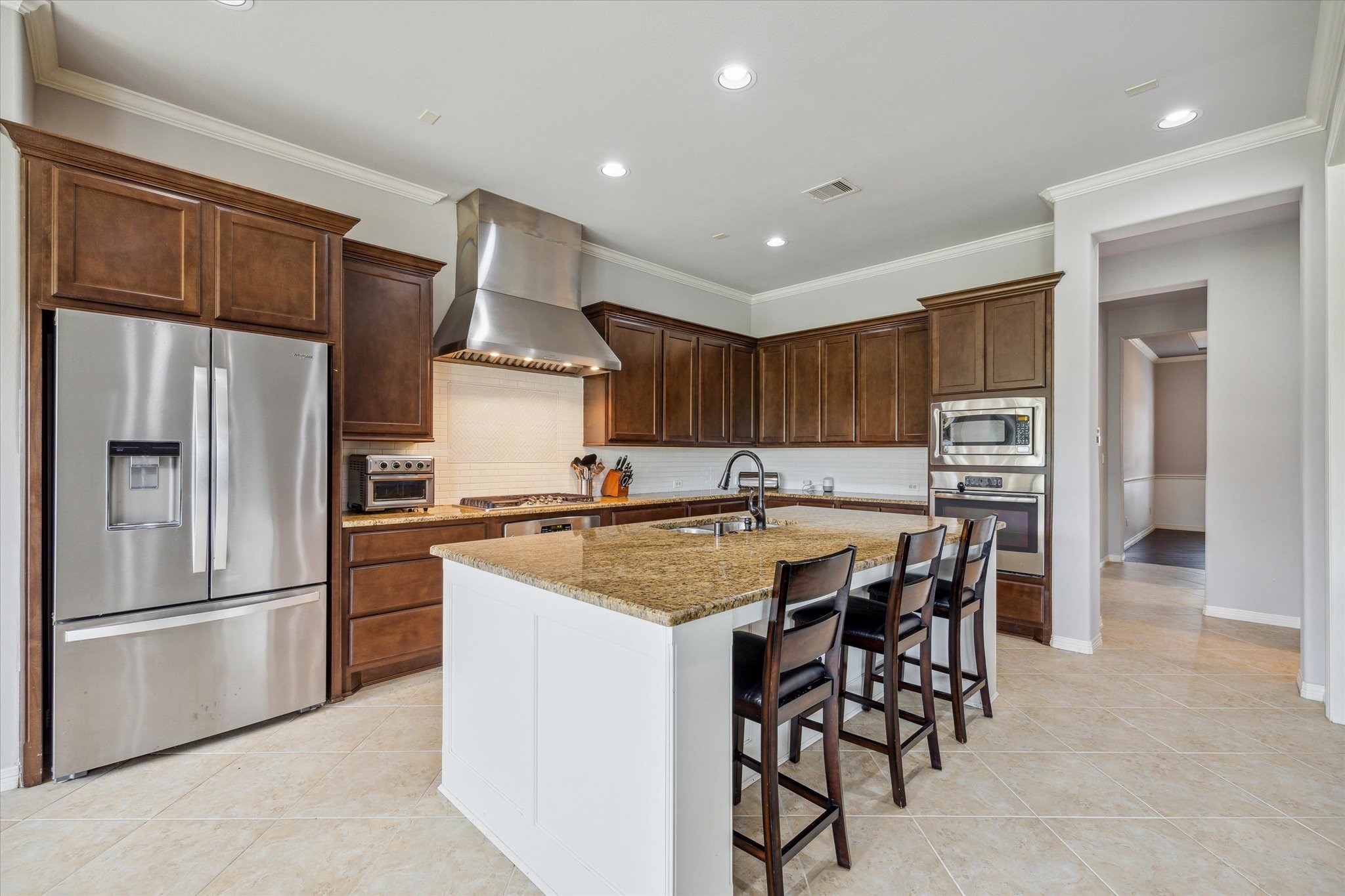 18531 Duke Lake Drive Spring, TX 77388 - Photo 14 of 41 a kitchen with stainless steel appliances granite countertop a refrigerator and a stove top oven