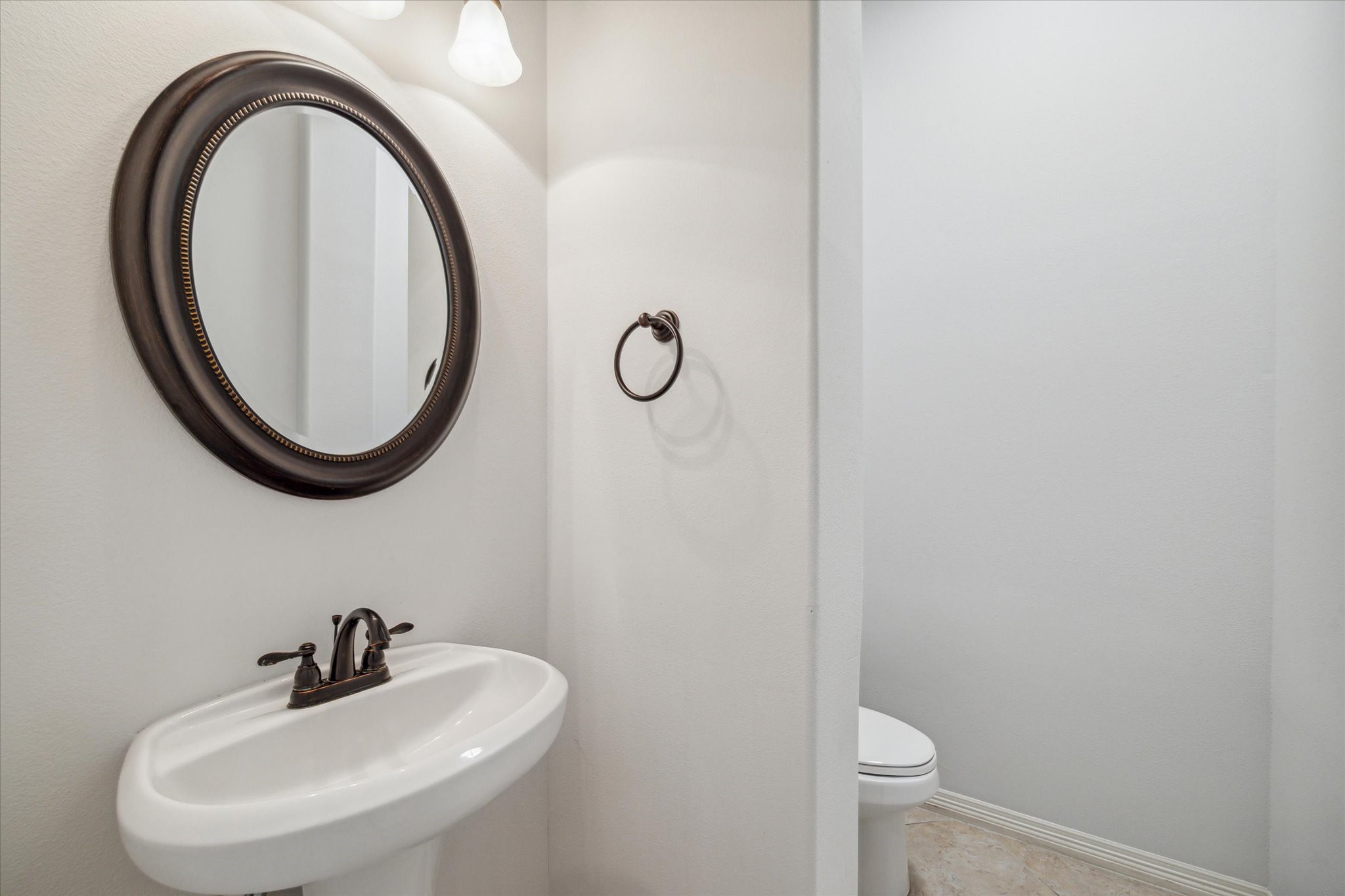 18531 Duke Lake Drive Spring, TX 77388 - Photo 18 of 41 a bathroom with a sink and a mirror