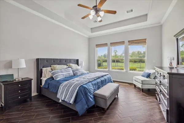 a bedroom with a bed and a couch