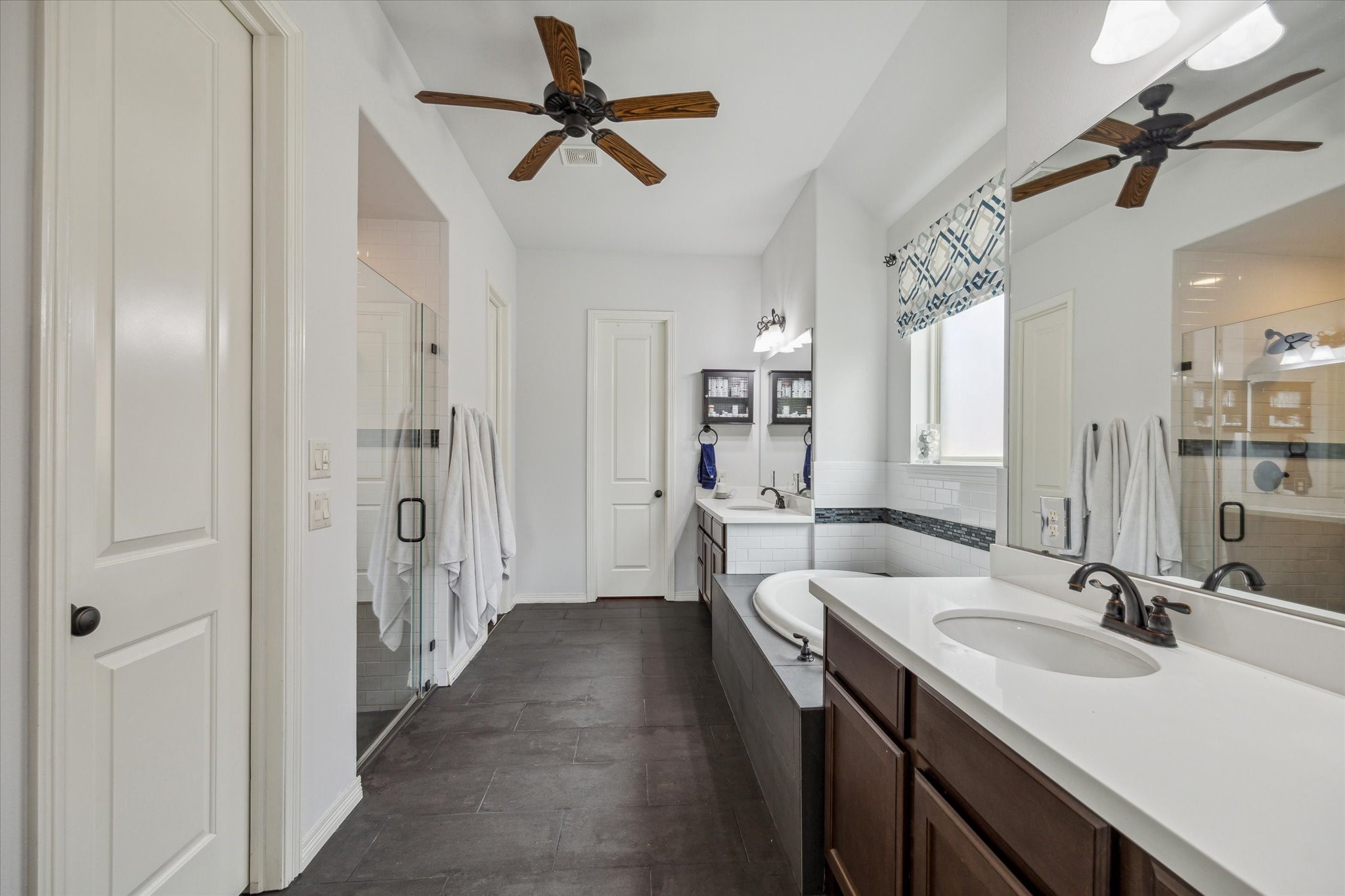18531 Duke Lake Drive Spring, TX 77388 - Photo 21 of 41 a en suite bathroom with a double vanity sink a mirror and shower