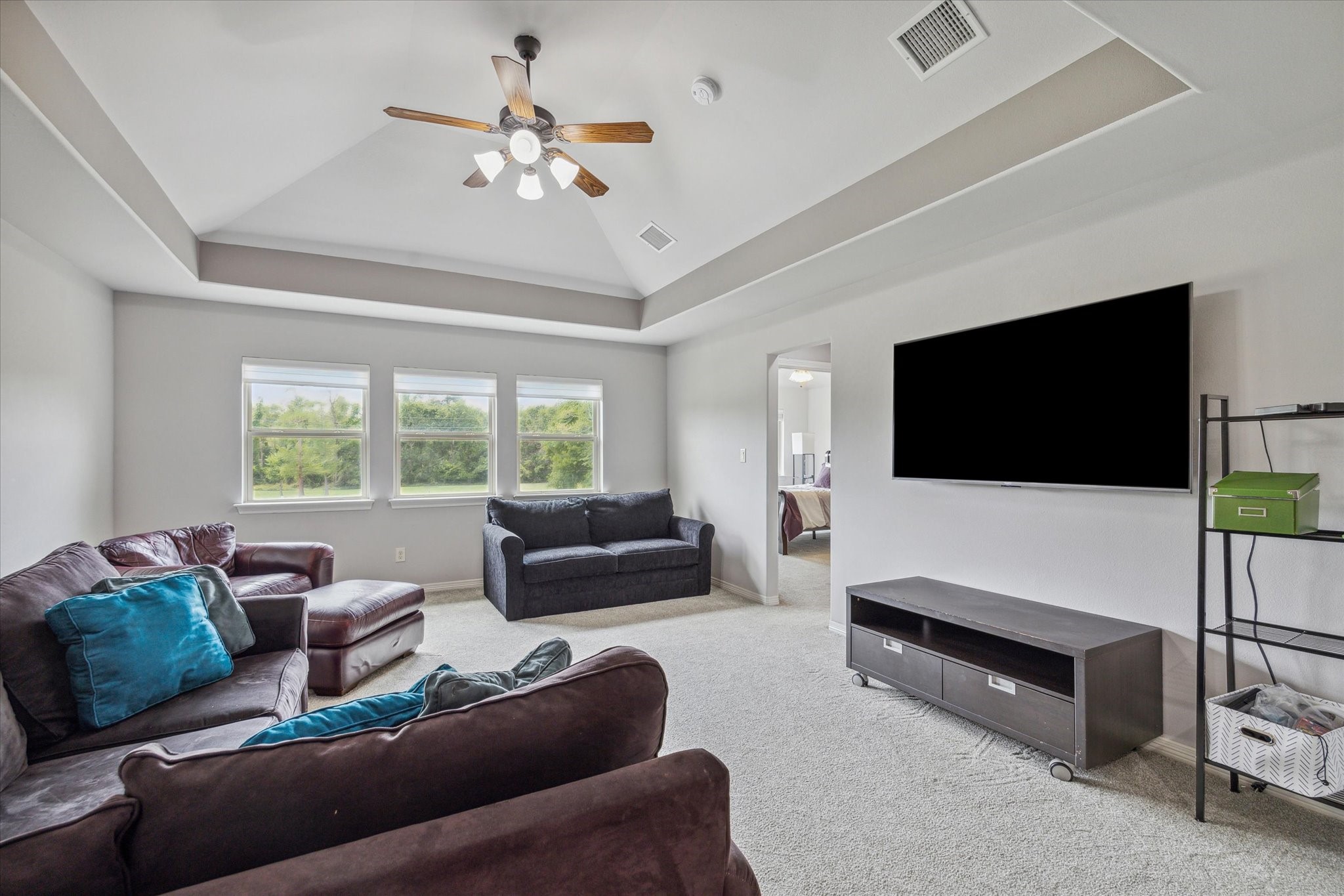 18531 Duke Lake Drive Spring, TX 77388 - Photo 23 of 41 a living room with furniture and a flat screen tv