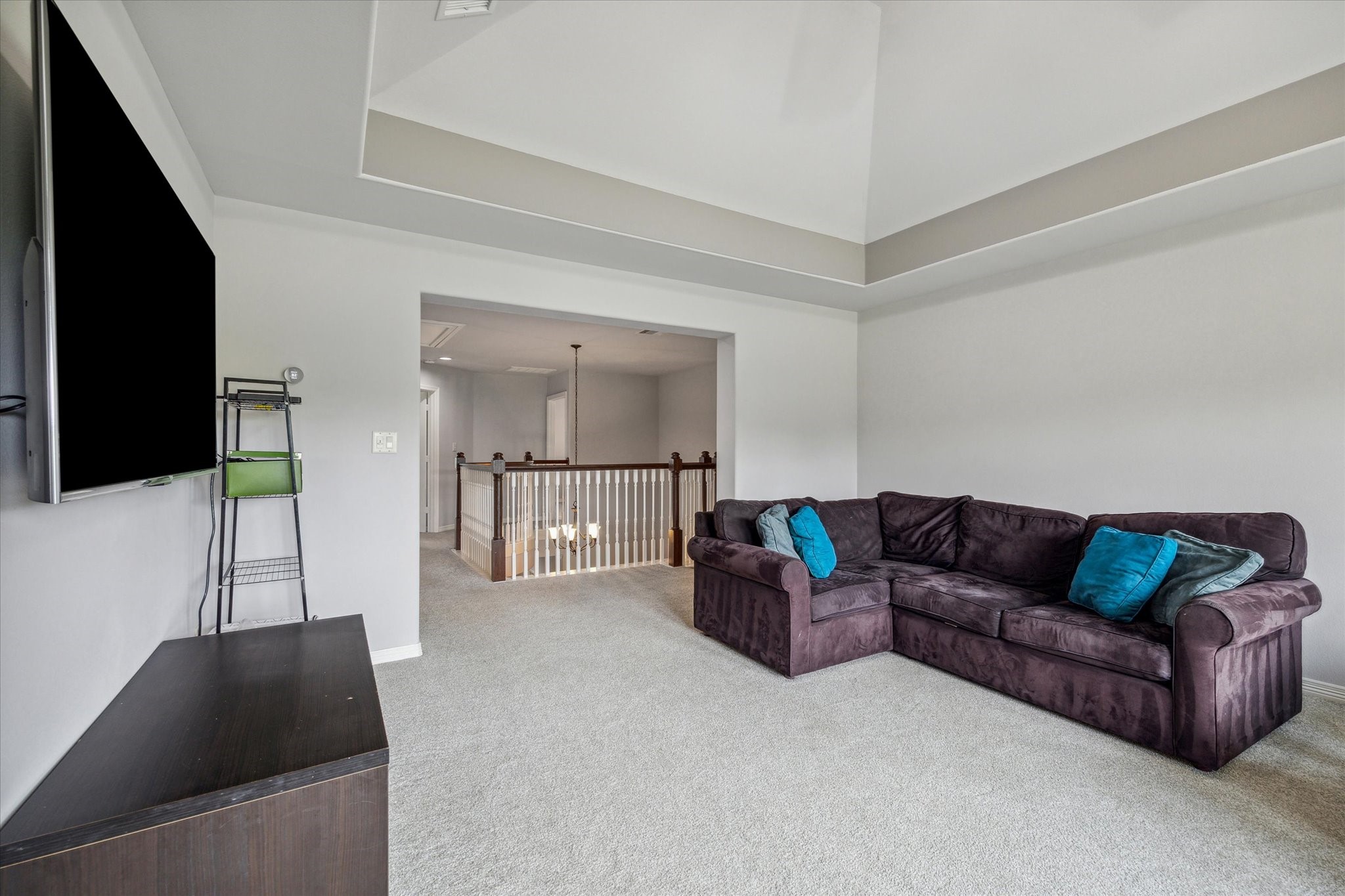18531 Duke Lake Drive Spring, TX 77388 - Photo 24 of 41 a living room with furniture and a flat screen tv