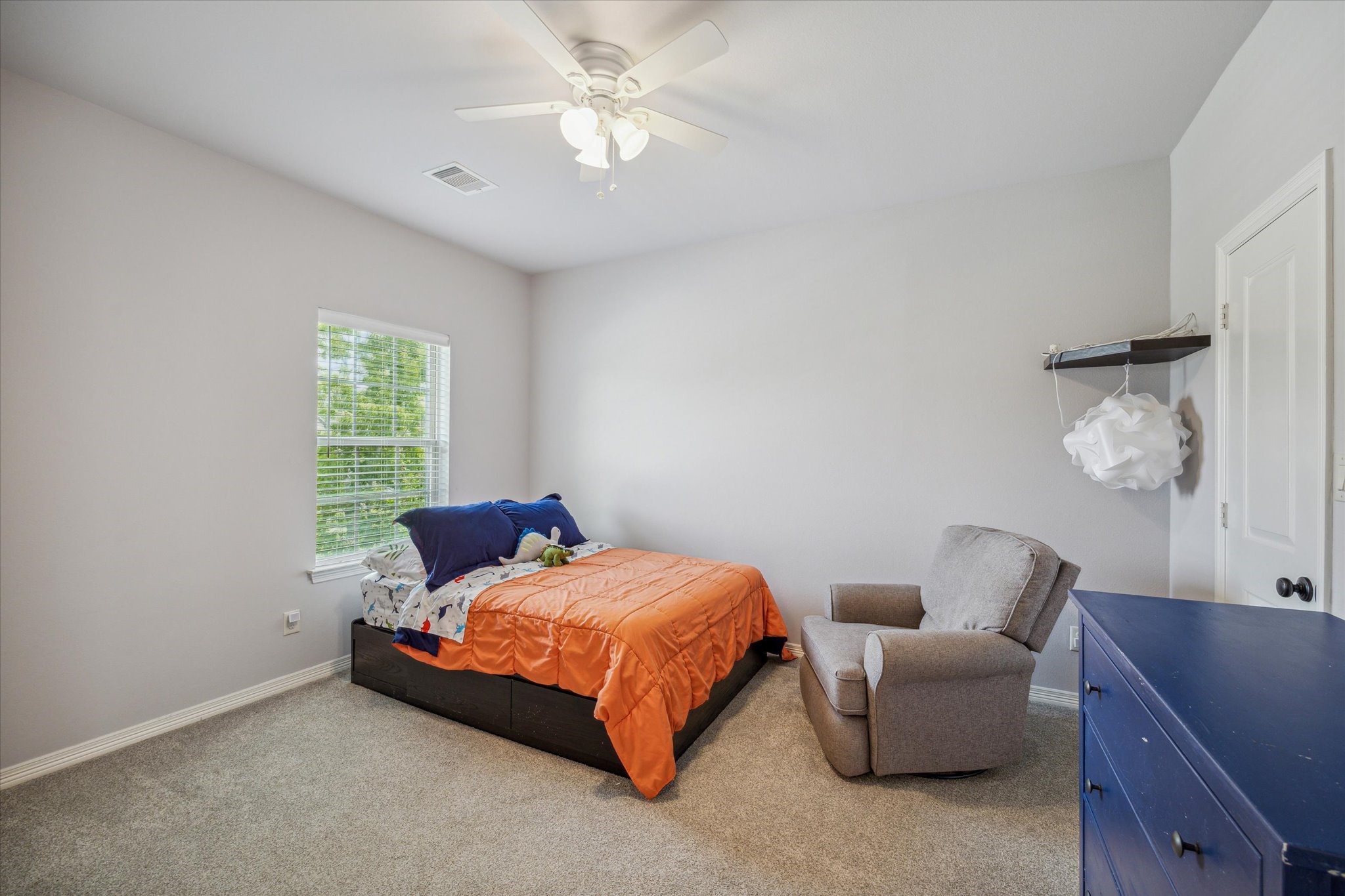 18531 Duke Lake Drive Spring, TX 77388 - Photo 27 of 41 a bedroom with a bed and a couch