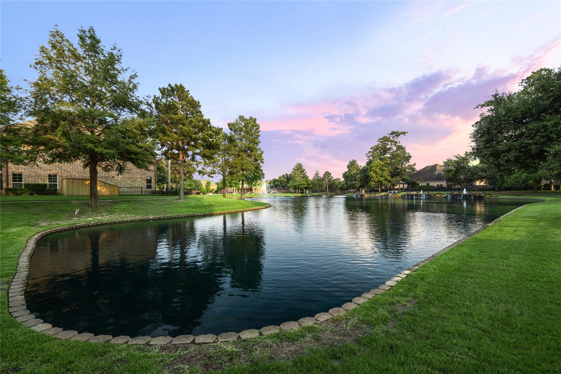18531 Duke Lake Drive Spring, TX 77388 - Photo 40 of 41 a view of a lake with a house in the background