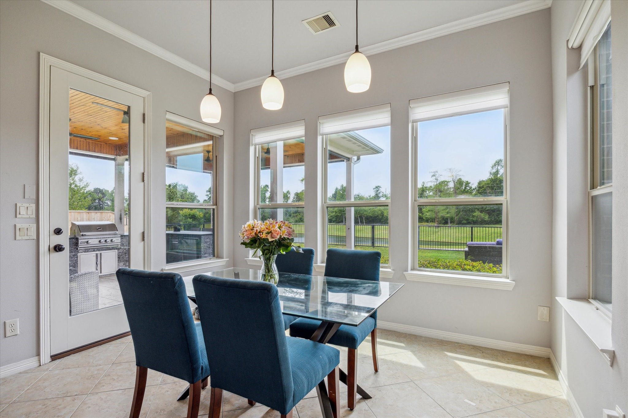 18531 Duke Lake Drive Spring, TX 77388 - Photo 9 of 41 a view of a dining room with furniture large windows and wooden floor