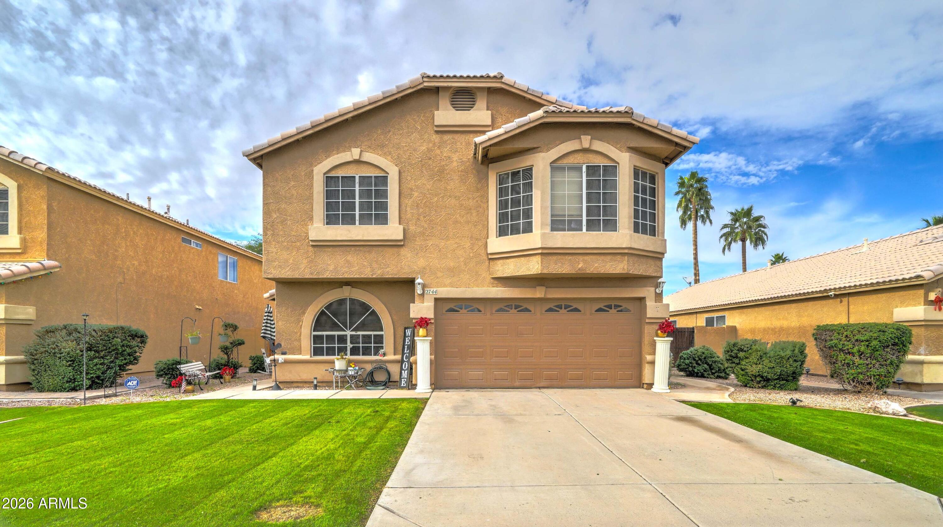 2744 South Raven Mesa, AZ 85209 - Photo 1 of 29 a front view of a house with a yard