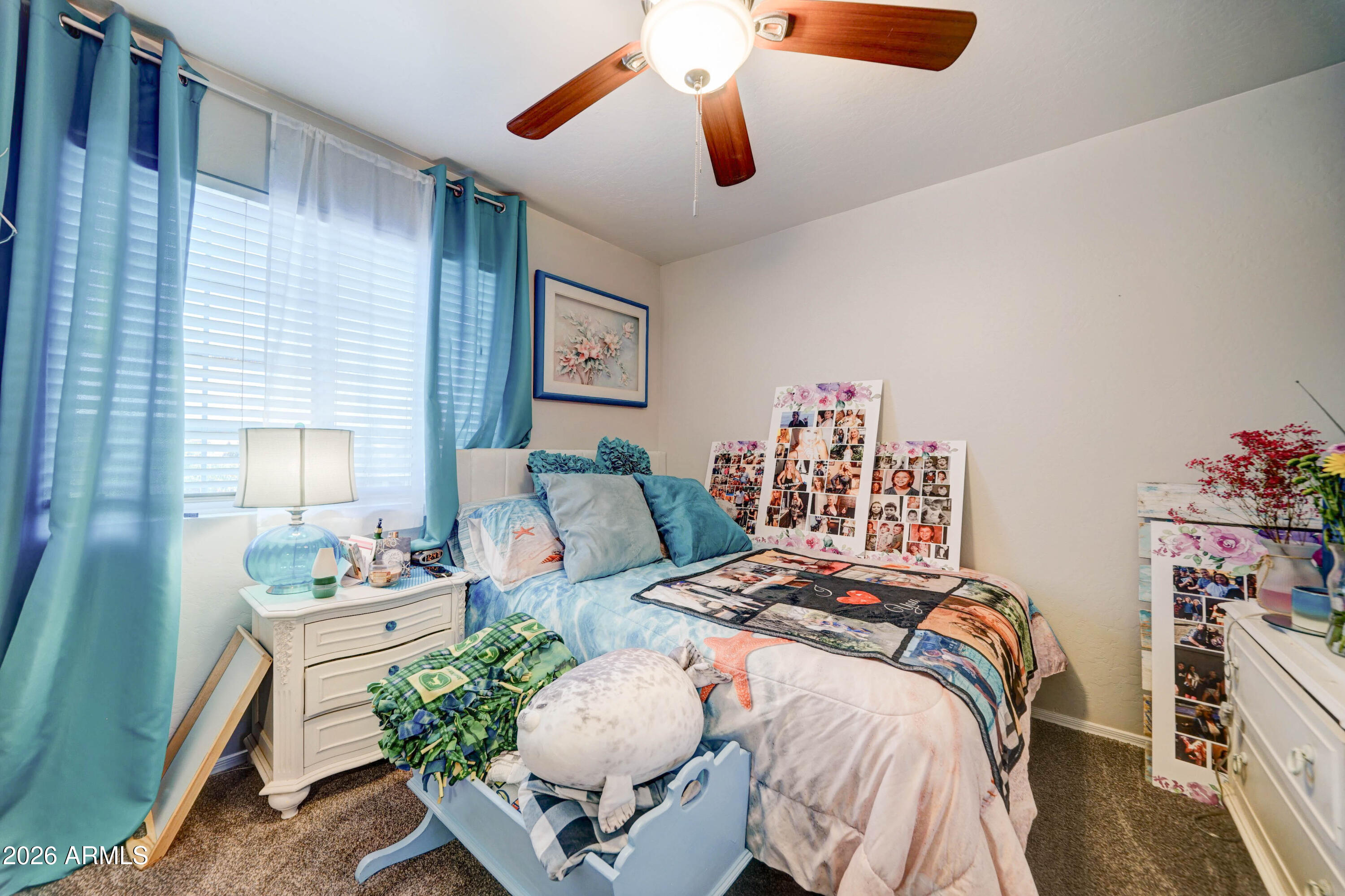 2744 South Raven Mesa, AZ 85209 - Photo 19 of 29 a bedroom with a bed and a chandelier