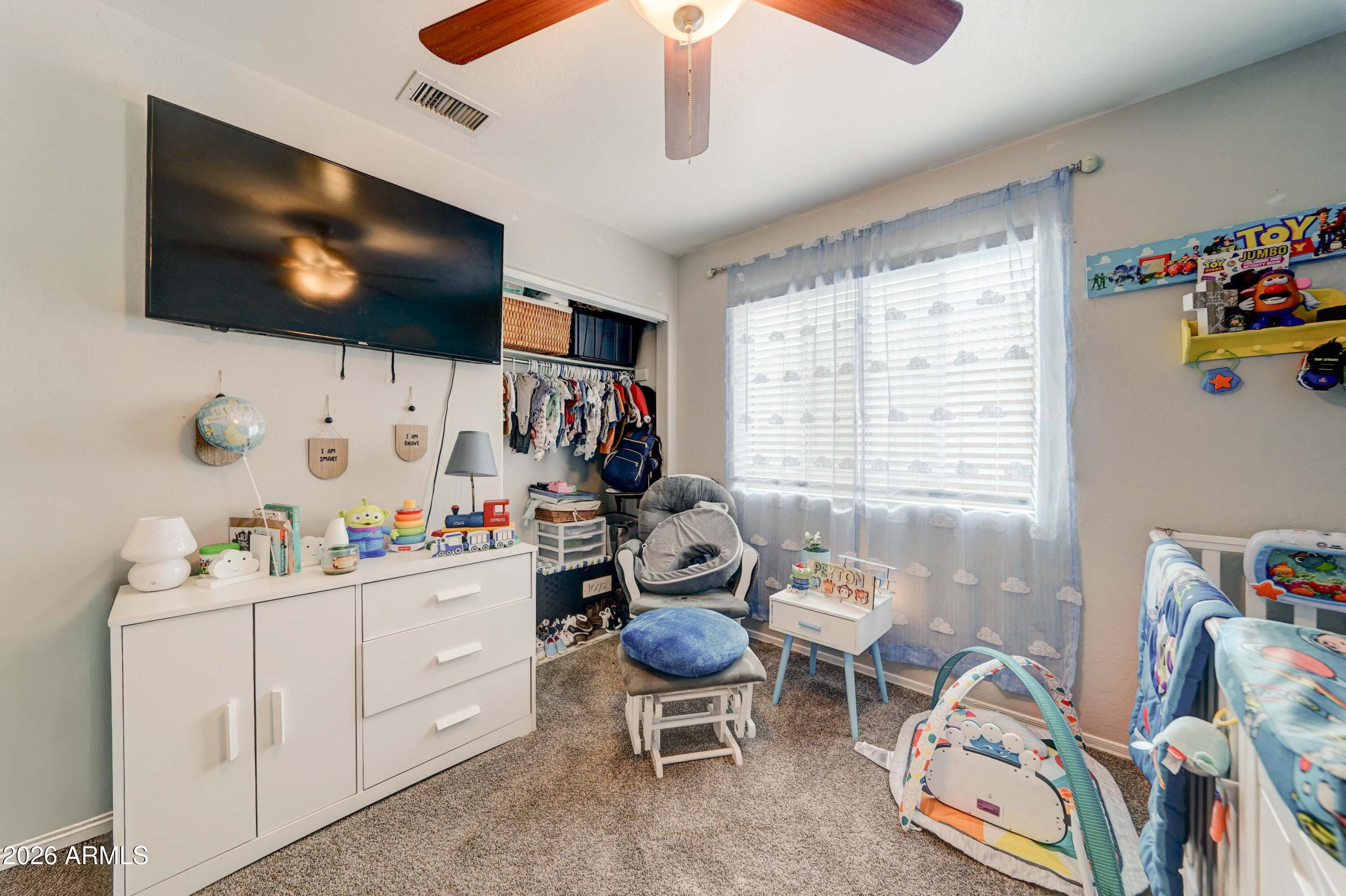 2744 South Raven Mesa, AZ 85209 - Photo 24 of 29 a living room with furniture and a flat screen tv