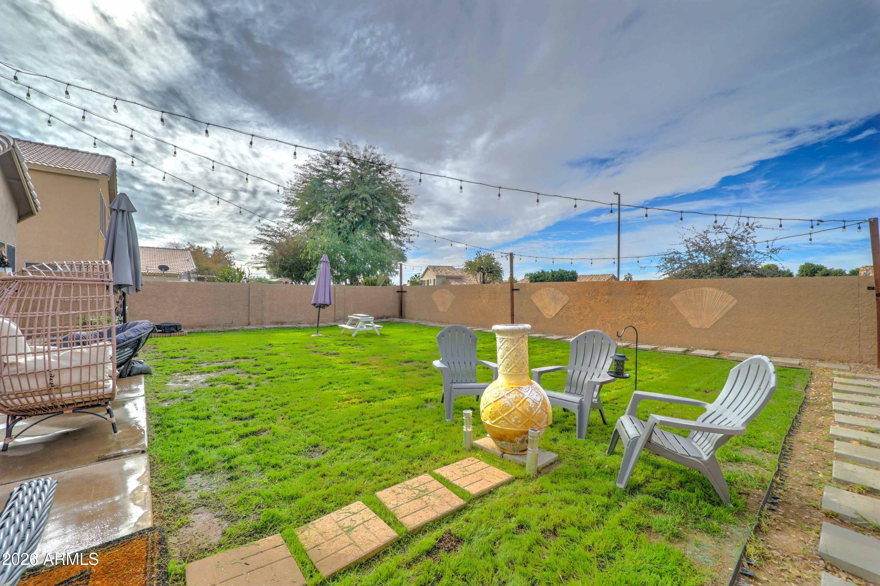 2744 South Raven Mesa, AZ 85209 - Photo 26 of 29 a backyard of a house with table and chairs