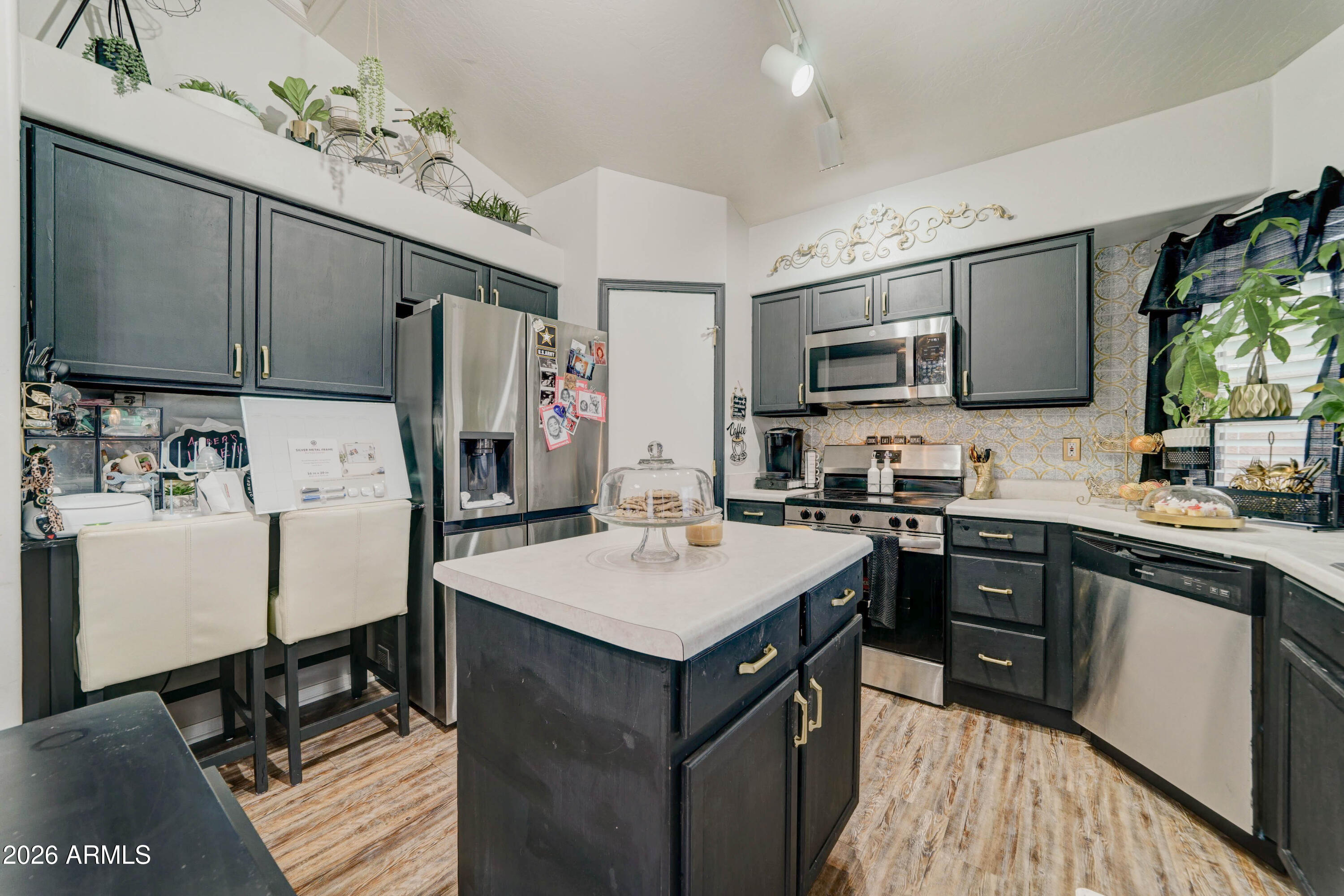 2744 South Raven Mesa, AZ 85209 - Photo 4 of 29 a kitchen with a sink stove and refrigerator