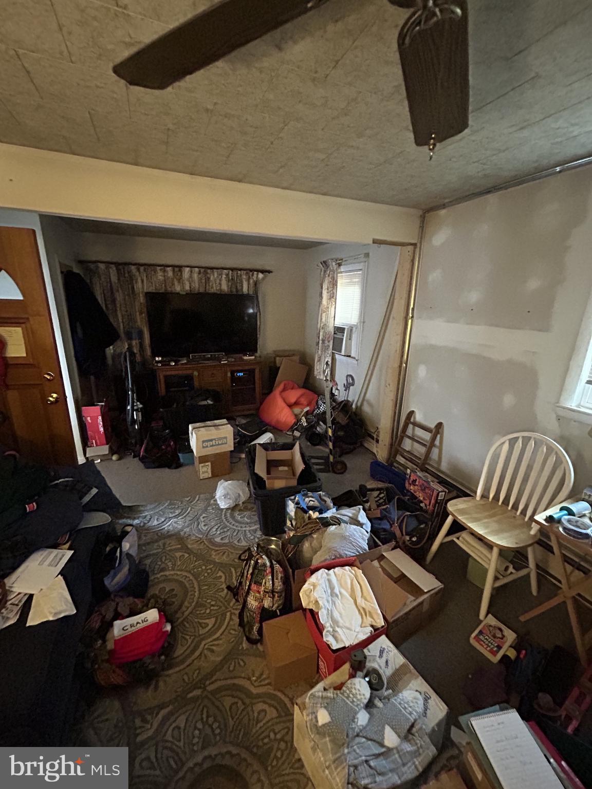 5948 Baltimore Street Baltimore, MD 21207 - Photo 13 of 32 a living room with furniture and a flat screen tv