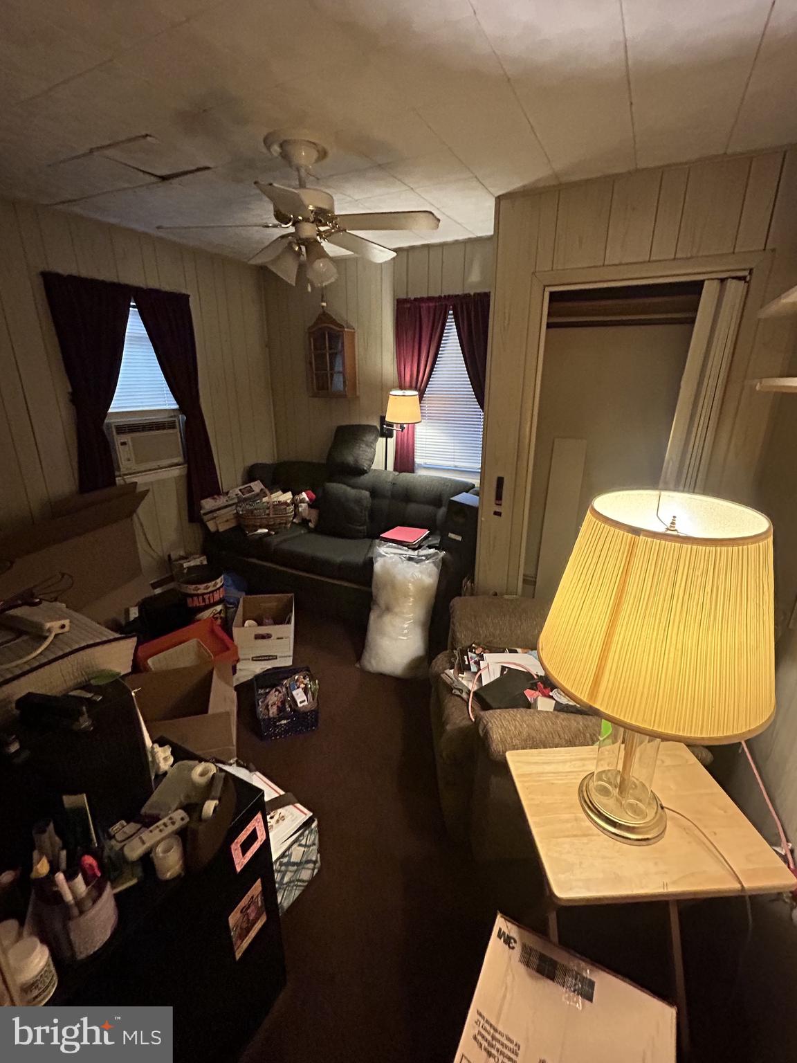 5948 Baltimore Street Baltimore, MD 21207 - Photo 21 of 32 a bedroom with a bed and a lamp